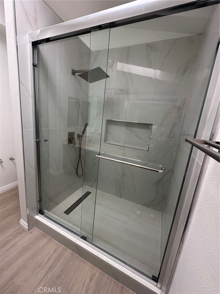 13470 Mallorca Lane Chino Hills, CA 91709 - Photo 33 of 44 a bathroom with a glass shower door