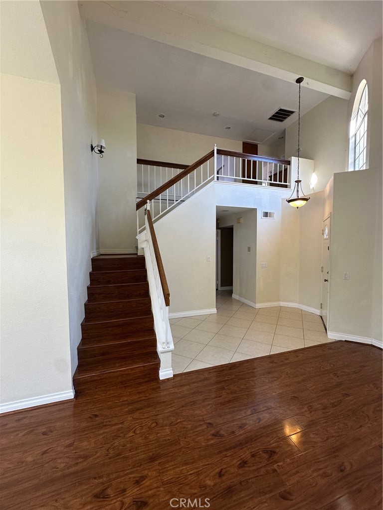 13470 Mallorca Lane Chino Hills, CA 91709 - Photo 8 of 44 a view of a hallway with wooden floor and entryway