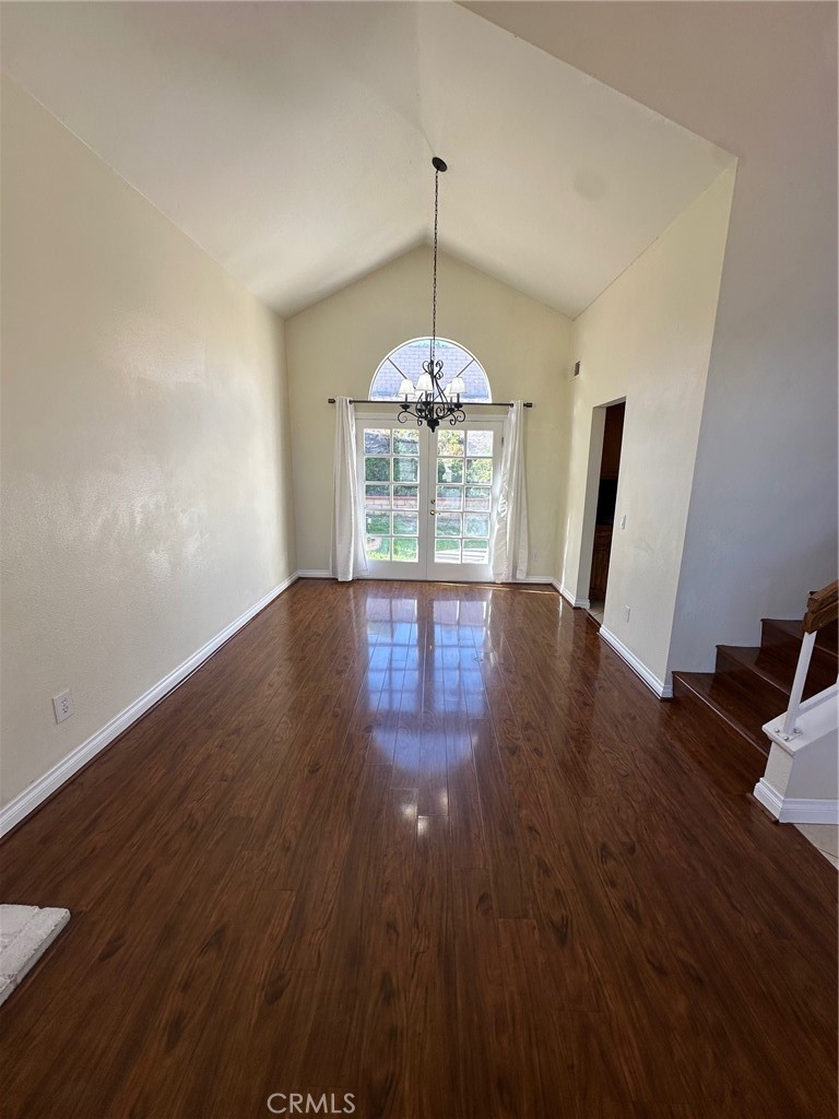 13470 Mallorca Lane Chino Hills, CA 91709 - Photo 9 of 44 a view of an empty room with window and wooden floor