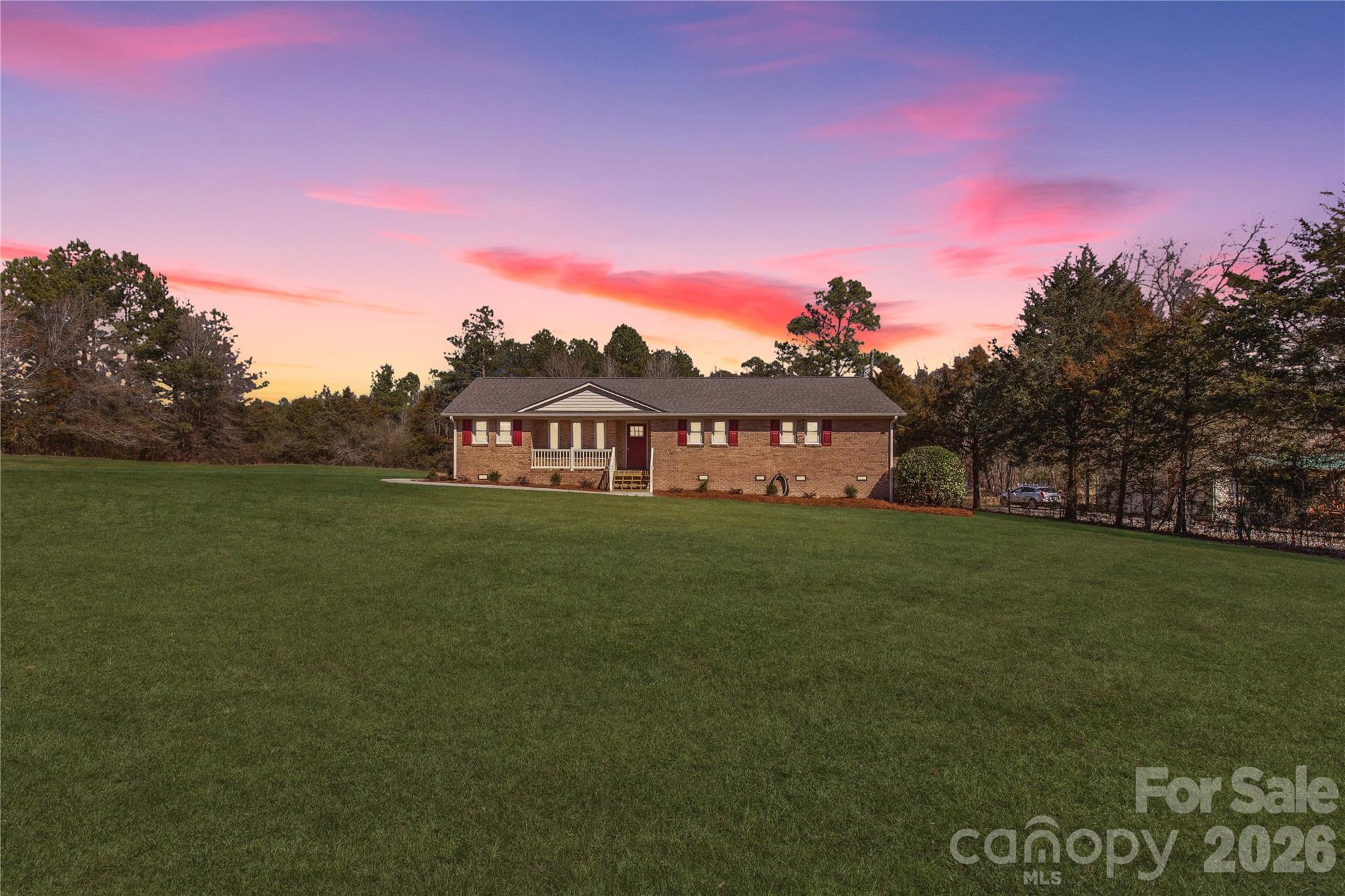 a view of a big house with a big yard