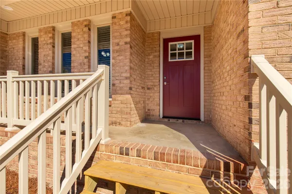 a view of balcony with wooden floor and stairs