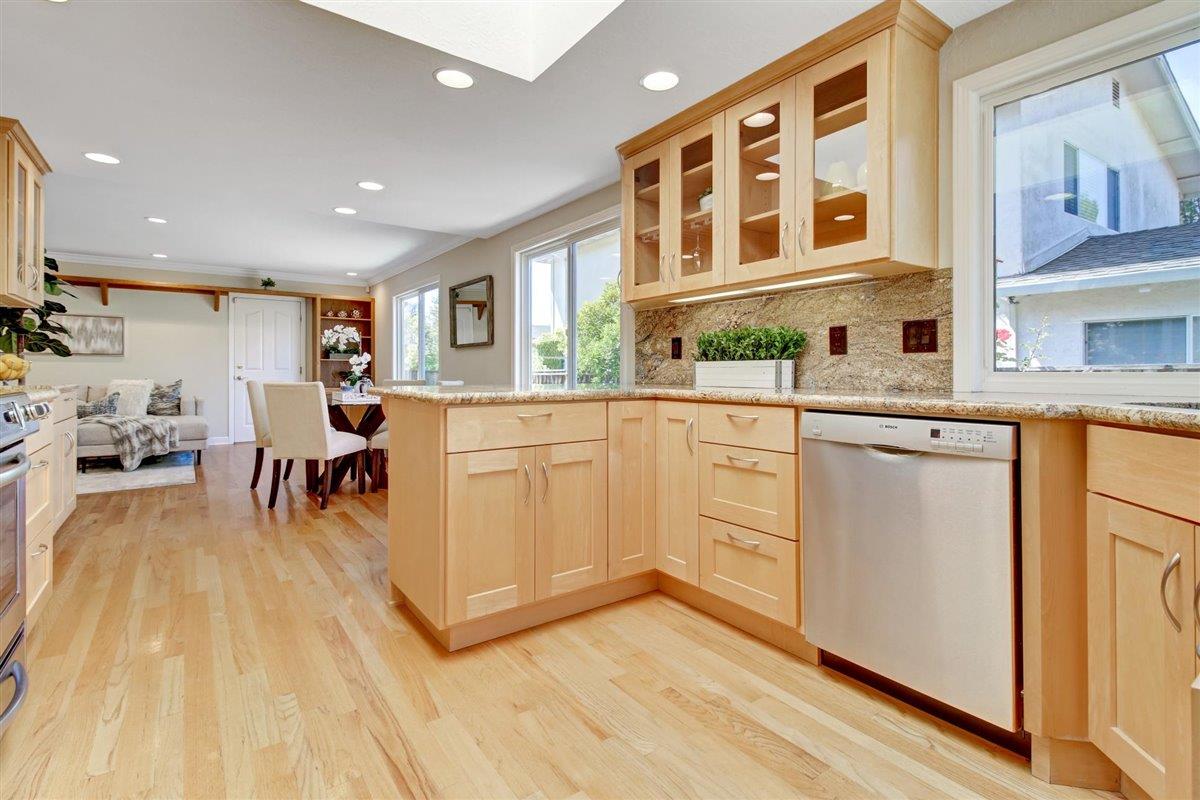 7068 Brooktree Way San Jose, CA 95120 - Photo 14 of 40 a kitchen with a sink and wooden cabinets
