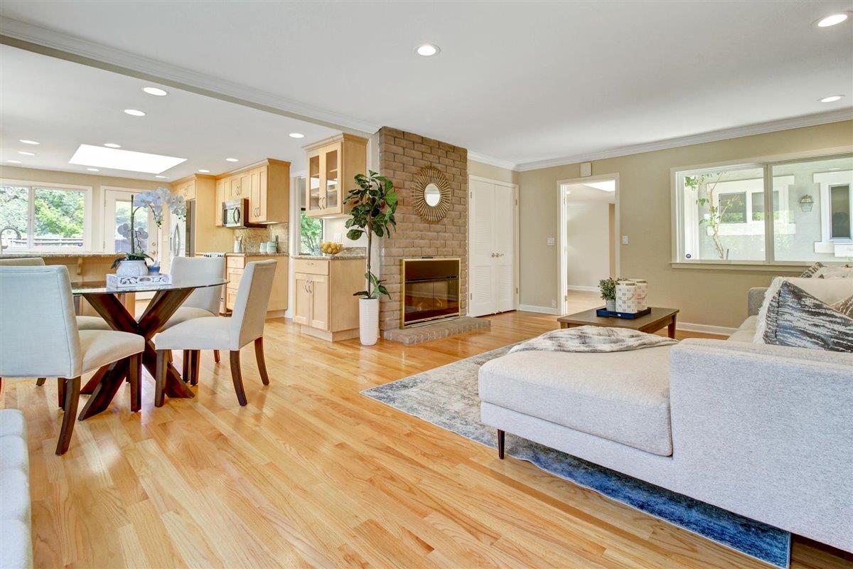 7068 Brooktree Way San Jose, CA 95120 - Photo 16 of 40 a living room with furniture and a fireplace