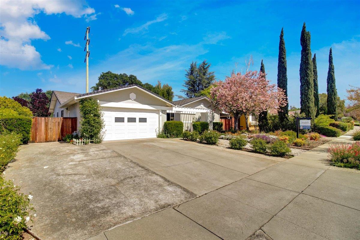 7068 Brooktree Way San Jose, CA 95120 - Photo 2 of 40 a view of a house with a yard and potted plants
