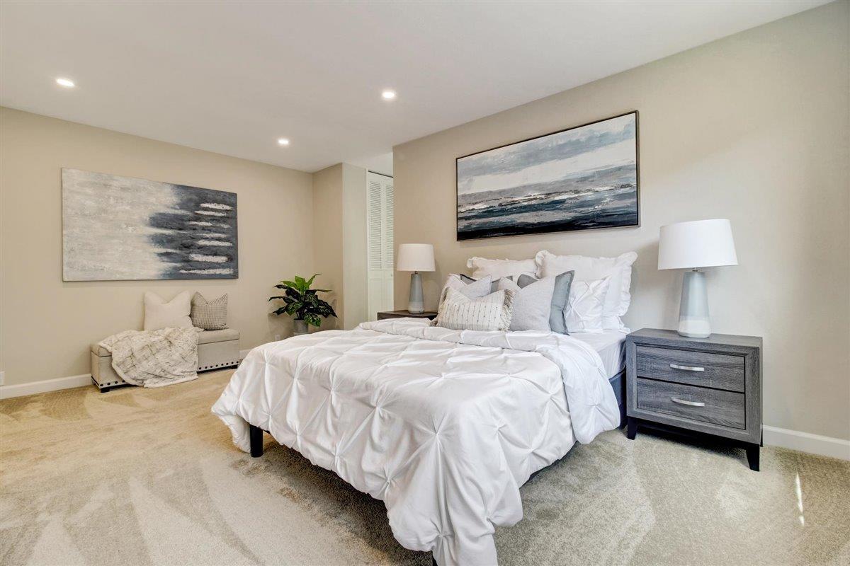 7068 Brooktree Way San Jose, CA 95120 - Photo 26 of 40 a bedroom with bed and a painting on the wall