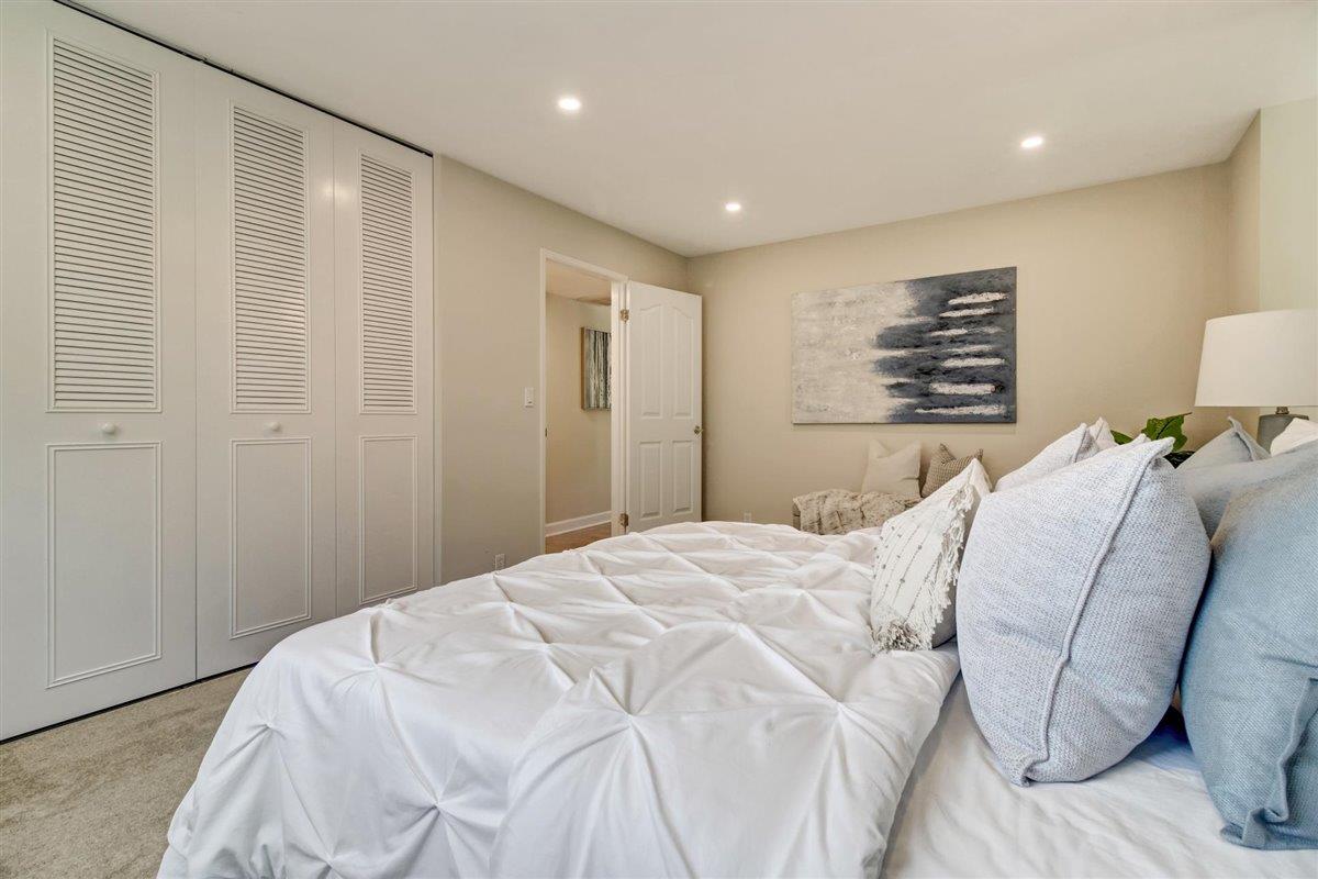 7068 Brooktree Way San Jose, CA 95120 - Photo 28 of 40 a bedroom with a bed and a couch