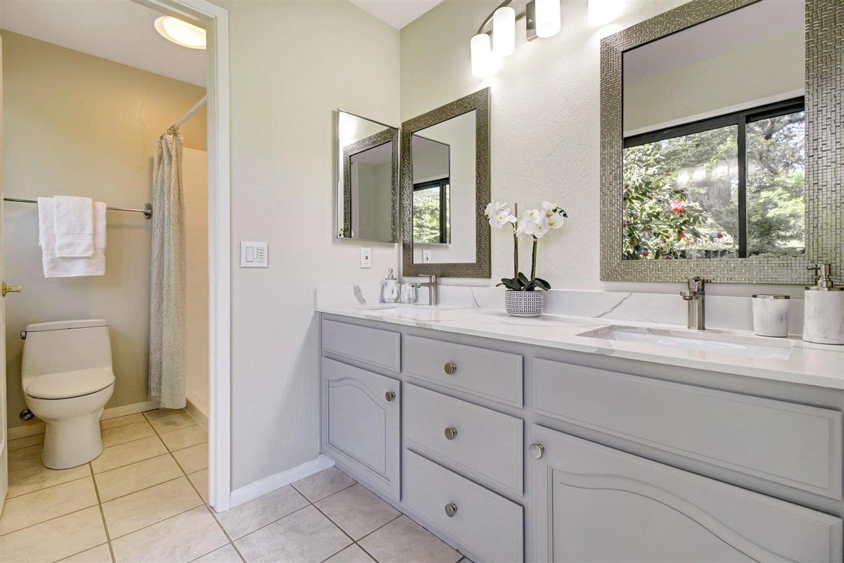 7068 Brooktree Way San Jose, CA 95120 - Photo 29 of 40 a bathroom with a toilet sink and mirror