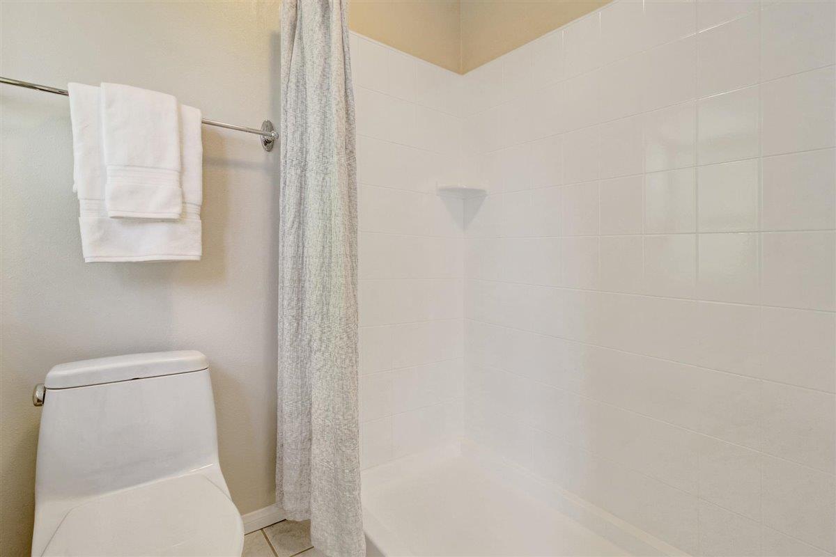 7068 Brooktree Way San Jose, CA 95120 - Photo 30 of 40 a white toilet sitting next to a shower