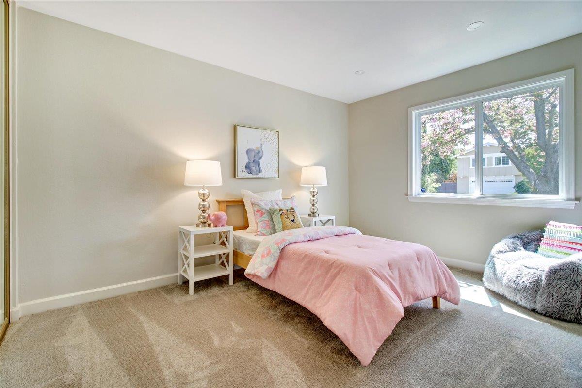 7068 Brooktree Way San Jose, CA 95120 - Photo 33 of 40 a bedroom with a bed and a large window