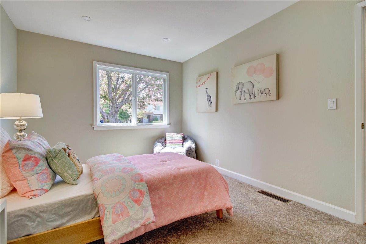7068 Brooktree Way San Jose, CA 95120 - Photo 34 of 40 a bedroom with a bed and a window