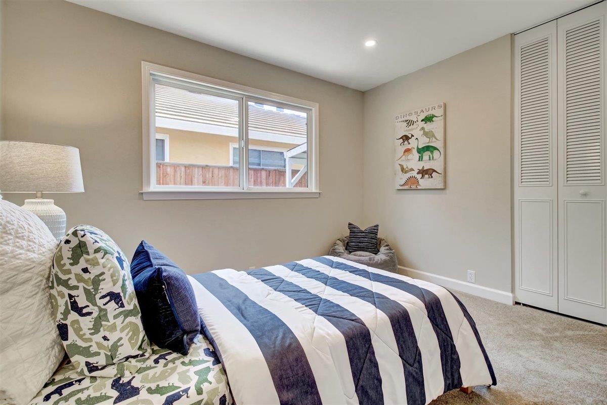7068 Brooktree Way San Jose, CA 95120 - Photo 36 of 40 a bedroom with a bed and painting on the wall