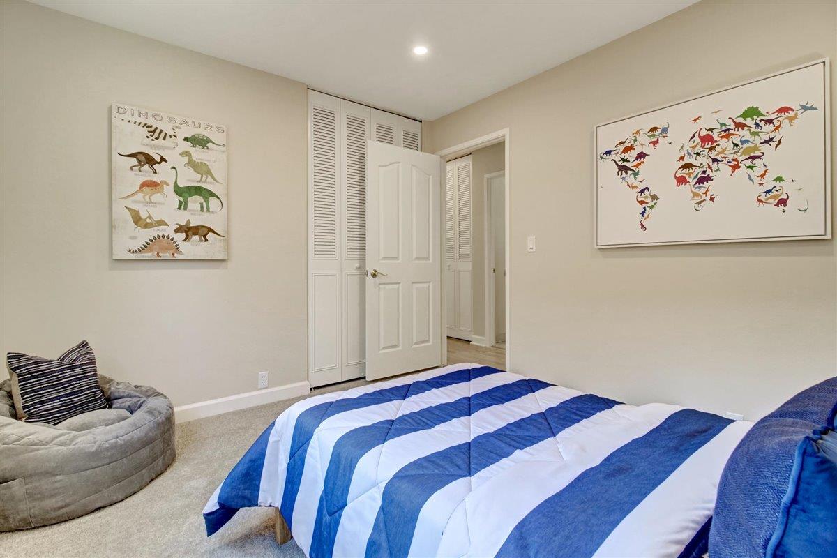 7068 Brooktree Way San Jose, CA 95120 - Photo 37 of 40 a bedroom with a bed and a painting on the wall