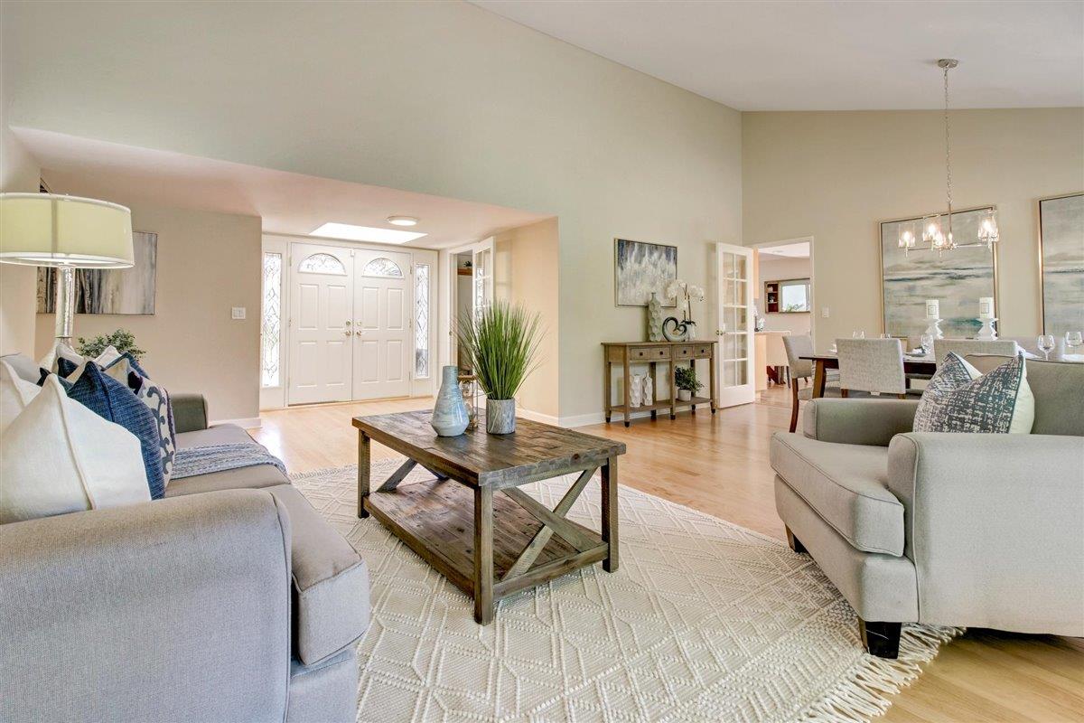 7068 Brooktree Way San Jose, CA 95120 - Photo 5 of 40 a living room with furniture and a table