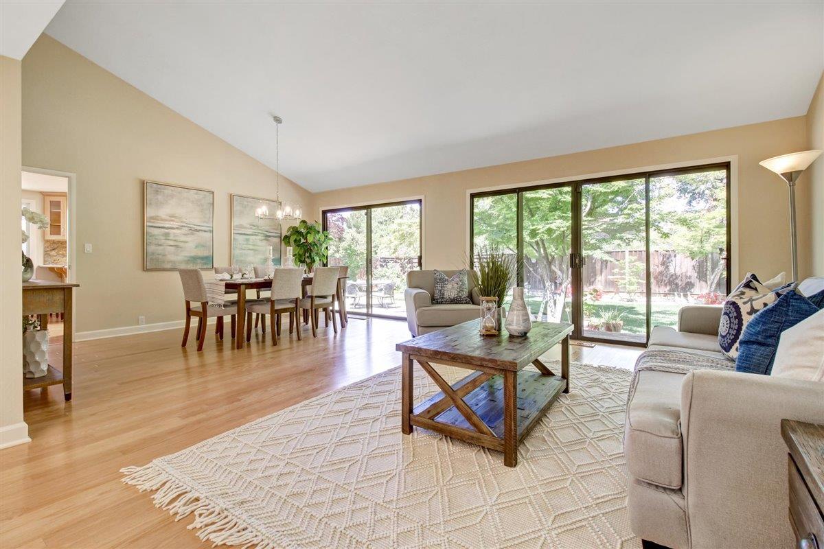 7068 Brooktree Way San Jose, CA 95120 - Photo 6 of 40 a living room with furniture large windows and wooden floor