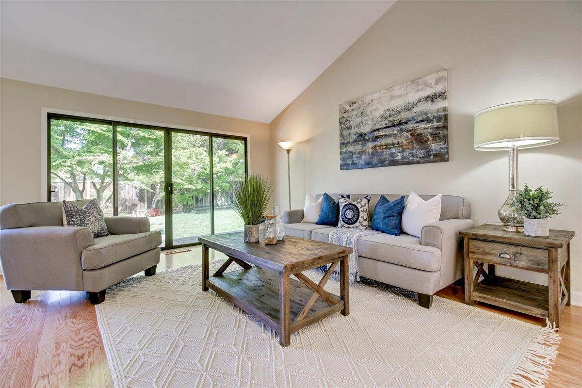 7068 Brooktree Way San Jose, CA 95120 - Photo 7 of 40 a living room with furniture and a large window