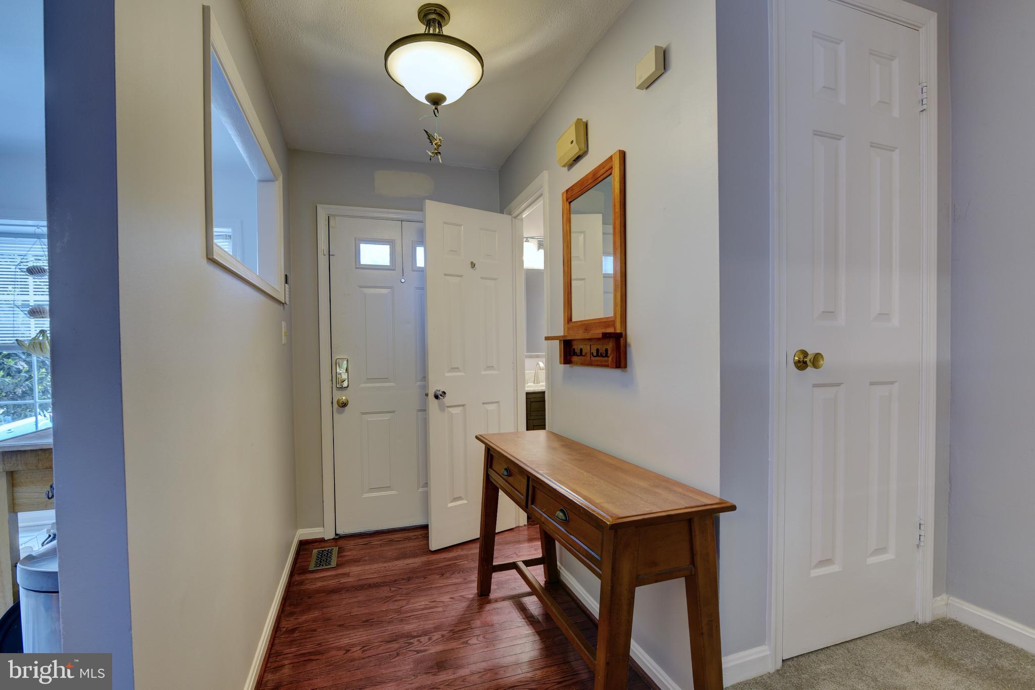 11926 Sentinel Point Court Reston, VA 20191 - Photo 2 of 26 Hardwood floors greet you in the foyer