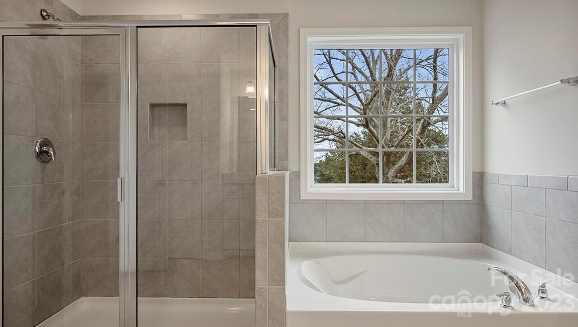 149 Fox Cove Road Hendersonville, NC 28792 - Photo 33 of 34 a bathroom with a bathtub and a shower