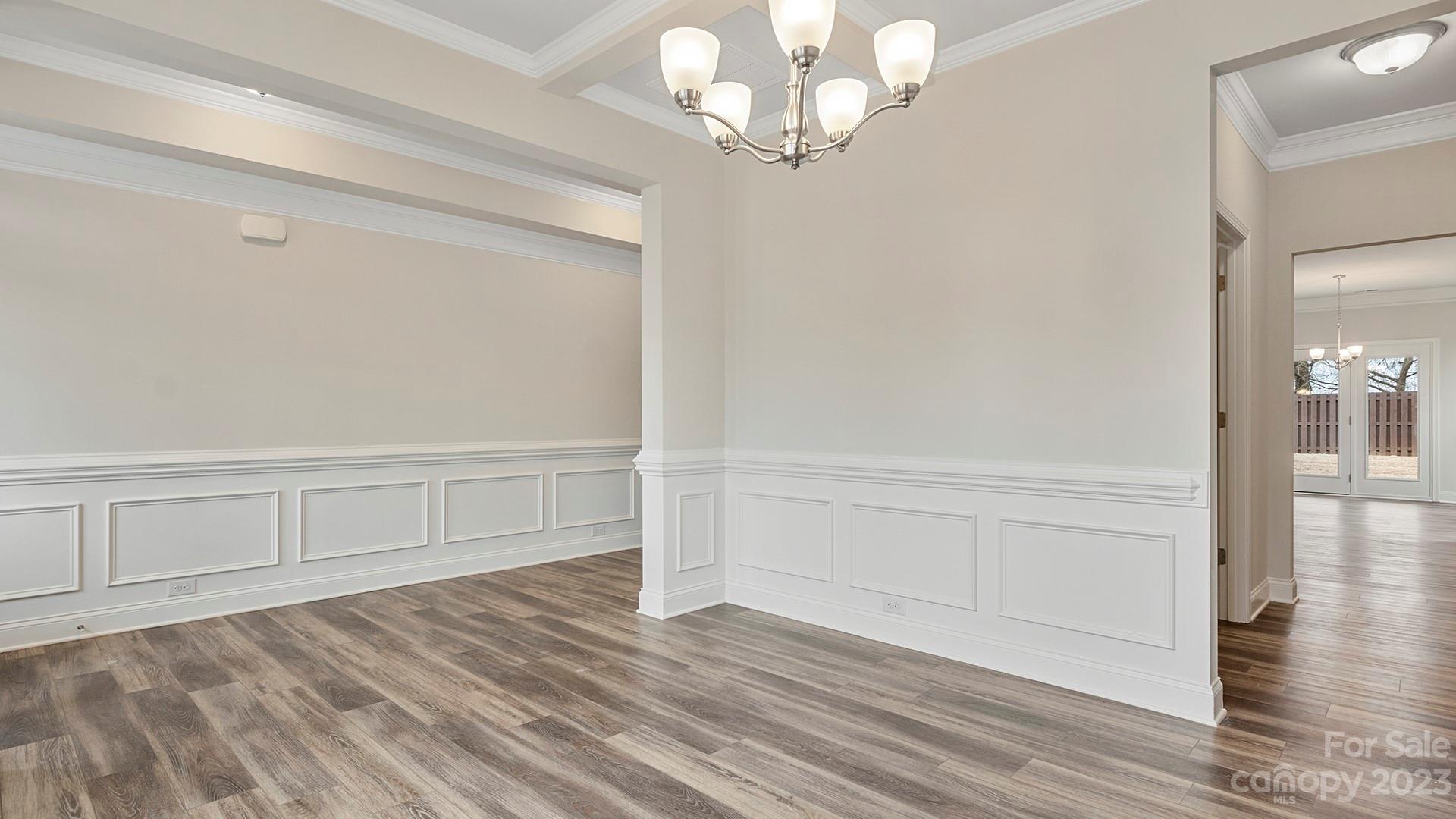 149 Fox Cove Road Hendersonville, NC 28792 - Photo 4 of 34 a view of an empty room with wooden floor and a window