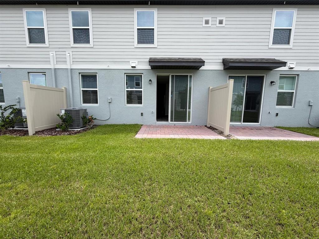 4264 Ranch House Road St. Cloud, FL 34772 - Photo 29 of 34 a view of a house with a yard and sitting area