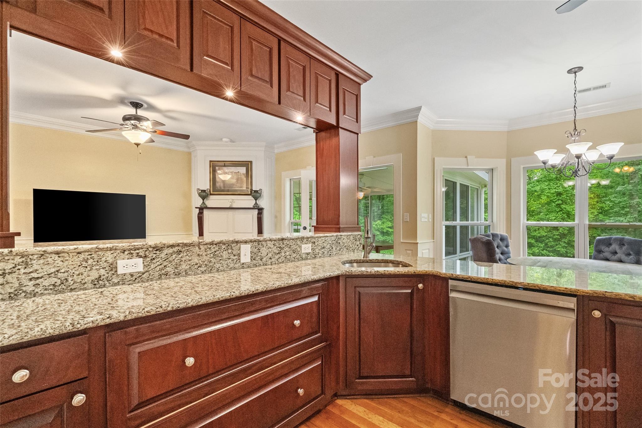 1669 Mary Ellen Drive Fort Mill, SC 29708 - Photo 12 of 48 a kitchen with granite countertop a sink and a wooden floor