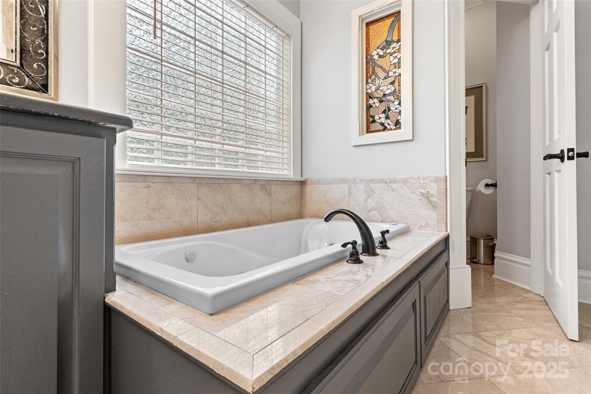 1669 Mary Ellen Drive Fort Mill, SC 29708 - Photo 20 of 48 a bath tub sitting next to a bathroom sink