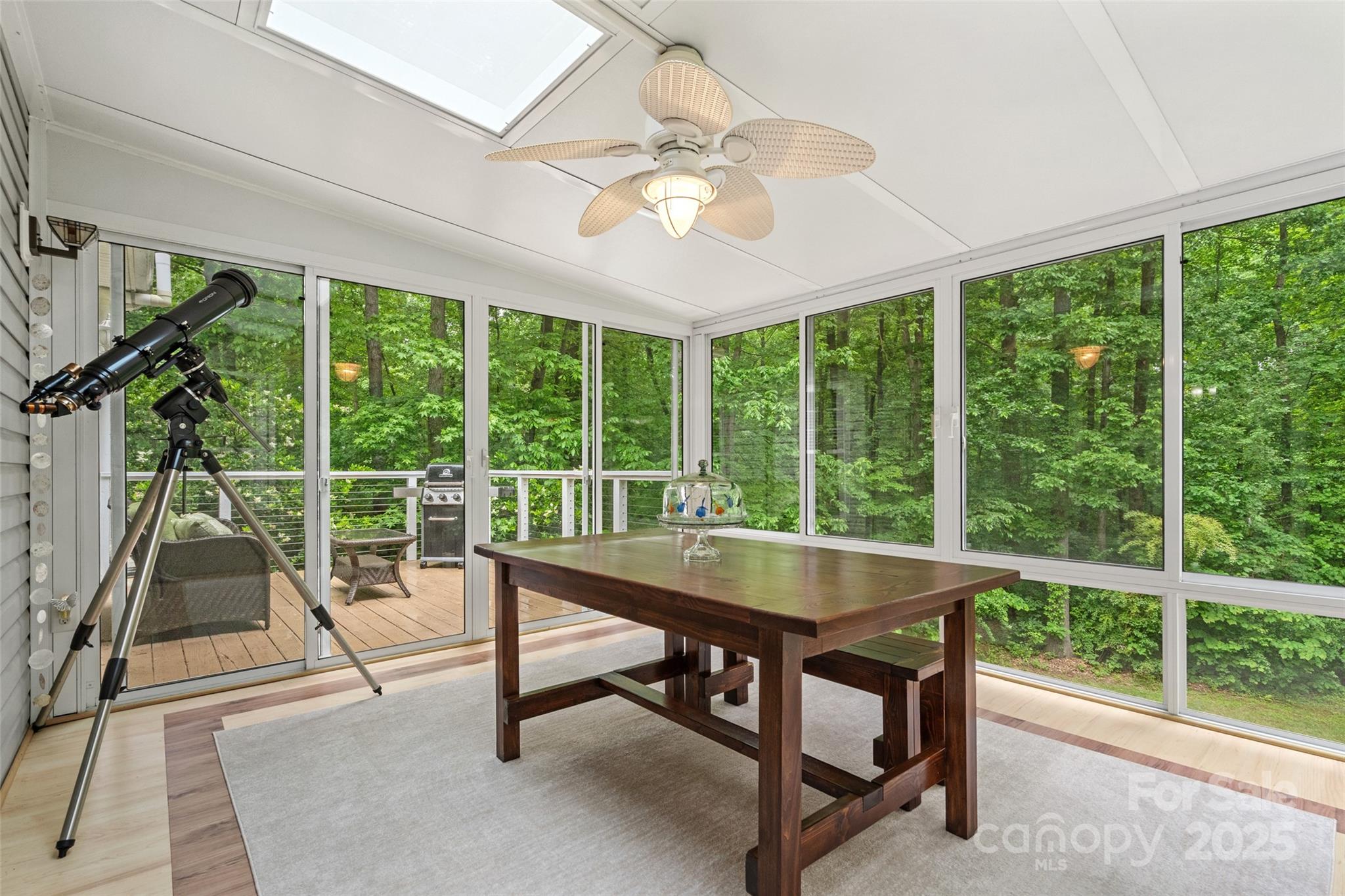 1669 Mary Ellen Drive Fort Mill, SC 29708 - Photo 28 of 48 a dining room with wooden floor fan and a floor to ceiling window