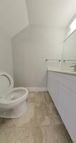 a bathroom with a toilet and a sink