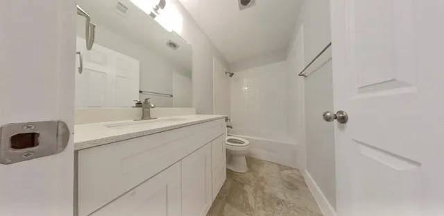 a view of a room with wooden floor and window