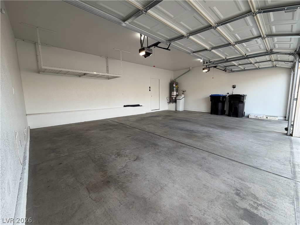 29 Olive Tree Henderson, NV 89074 - Photo 59 of 60 This spacious garage offers abundant storage solutions and seamless vehicle access.