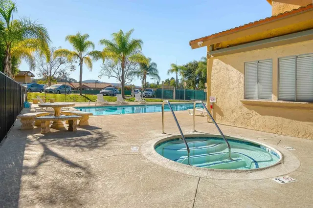 a view of a backyard with a fountain