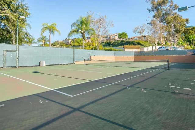 a view of an outdoor space and tennis court