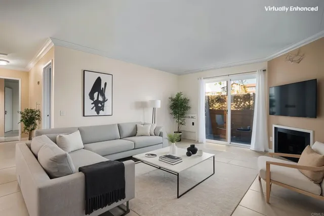 a living room with furniture a flat screen tv and a floor to ceiling window