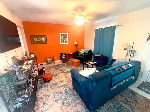 a living room with furniture and a flat screen tv