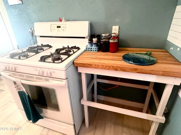 a kitchen with a stove and a microwave