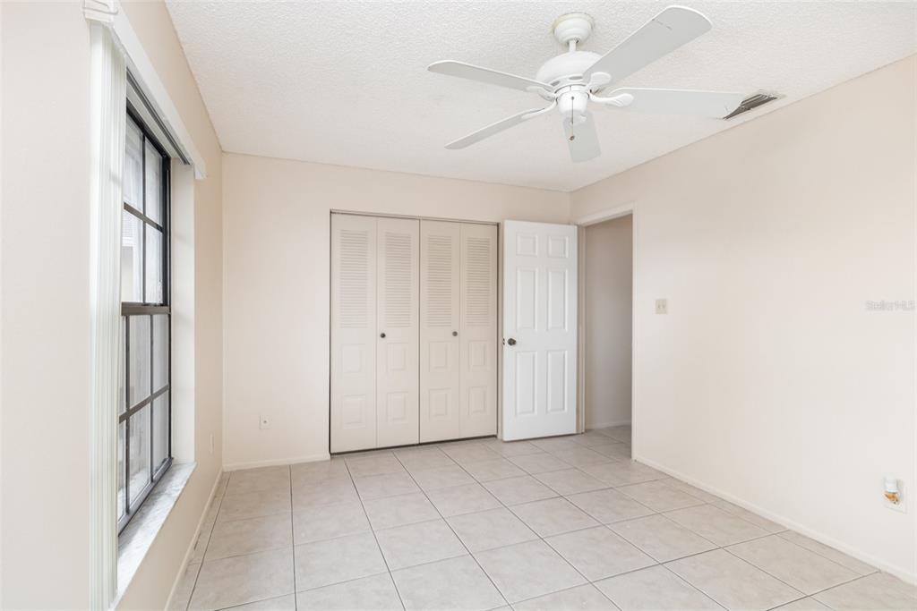 11714 Stamfield Drive Orlando, FL 32821 - Photo 12 of 15 a view of an empty room with a window