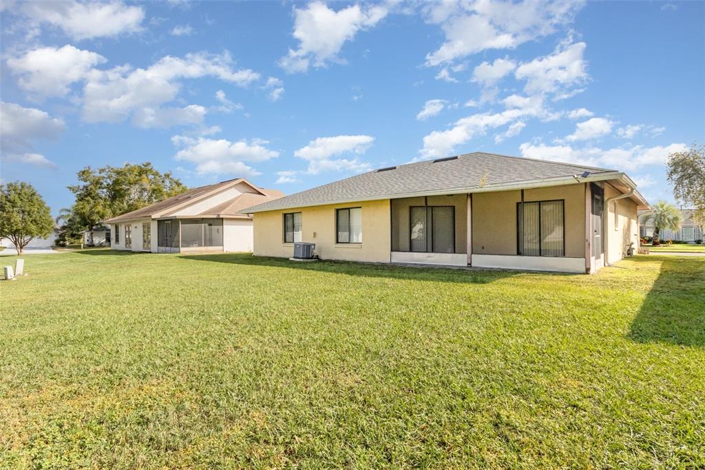 11714 Stamfield Drive Orlando, FL 32821 - Photo 15 of 15 a front view of a house with a garden