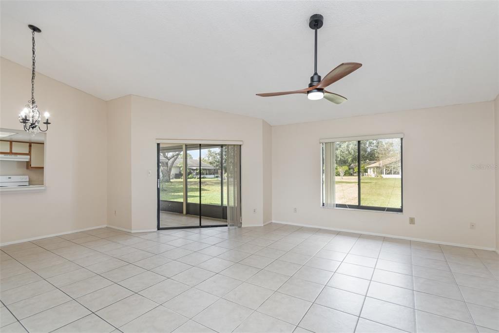 11714 Stamfield Drive Orlando, FL 32821 - Photo 4 of 15 a view of an empty room with a window