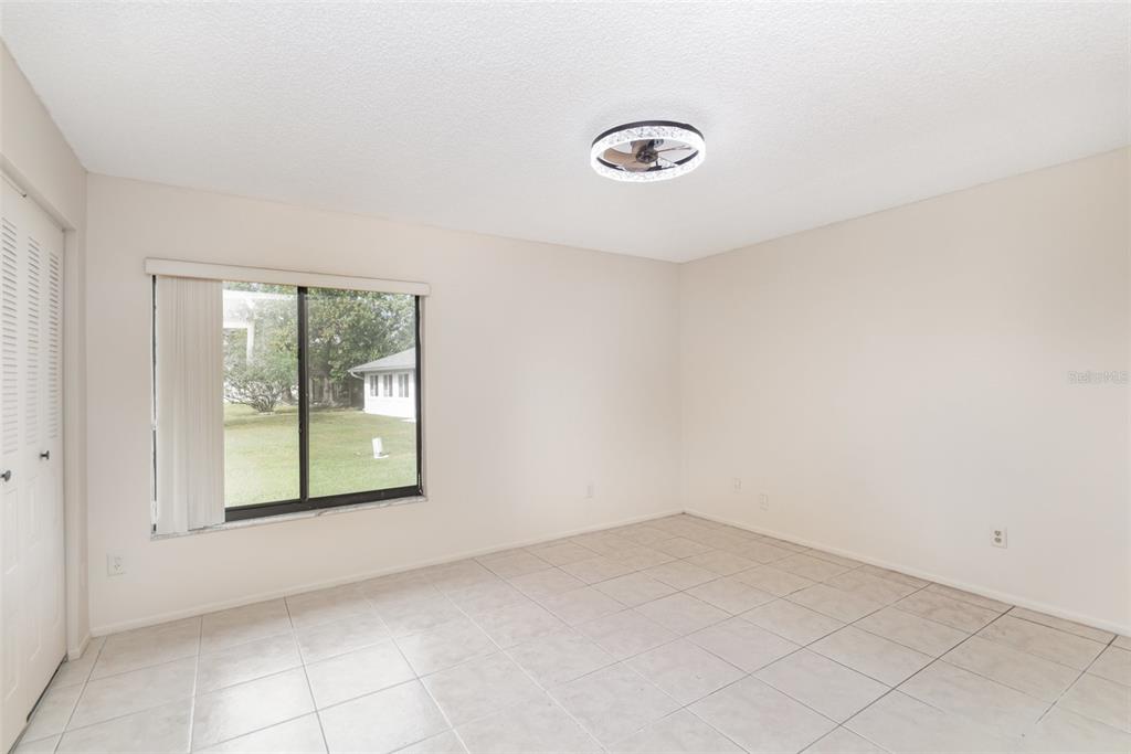 11714 Stamfield Drive Orlando, FL 32821 - Photo 9 of 15 an empty room with a window