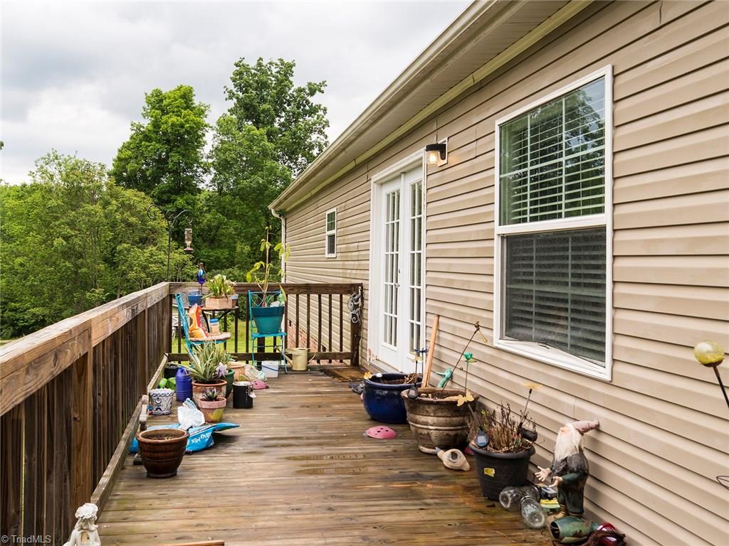 155 Kallam Mill Road Madison, NC 27025 - Photo 22 of 27 Back deck with access to dining room.
