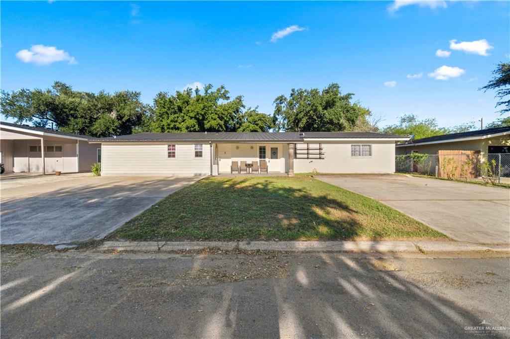 313 North 40th Street McAllen, TX 78501 - Photo 1 of 27 a view of a house with a backyard