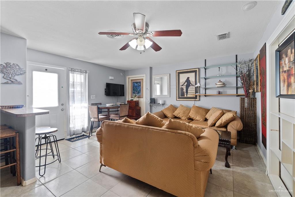313 North 40th Street McAllen, TX 78501 - Photo 18 of 27 a living room with furniture and a flat screen tv