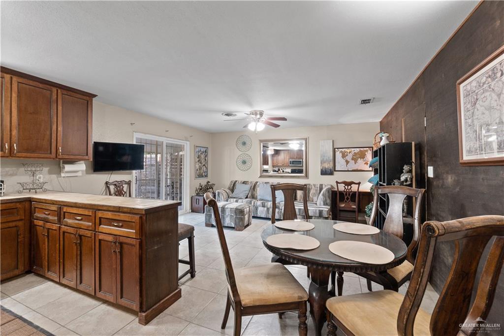 313 North 40th Street McAllen, TX 78501 - Photo 8 of 27 a view of a dining room with furniture and a kitchen