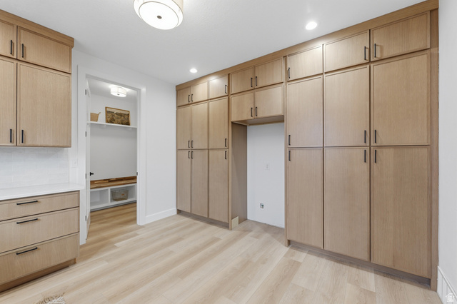 702 Alpine Highway Alpine, UT 84004 - Photo 34 of 83 Extensive built-in cabinetry with light wood-finish doors and matte black hardware