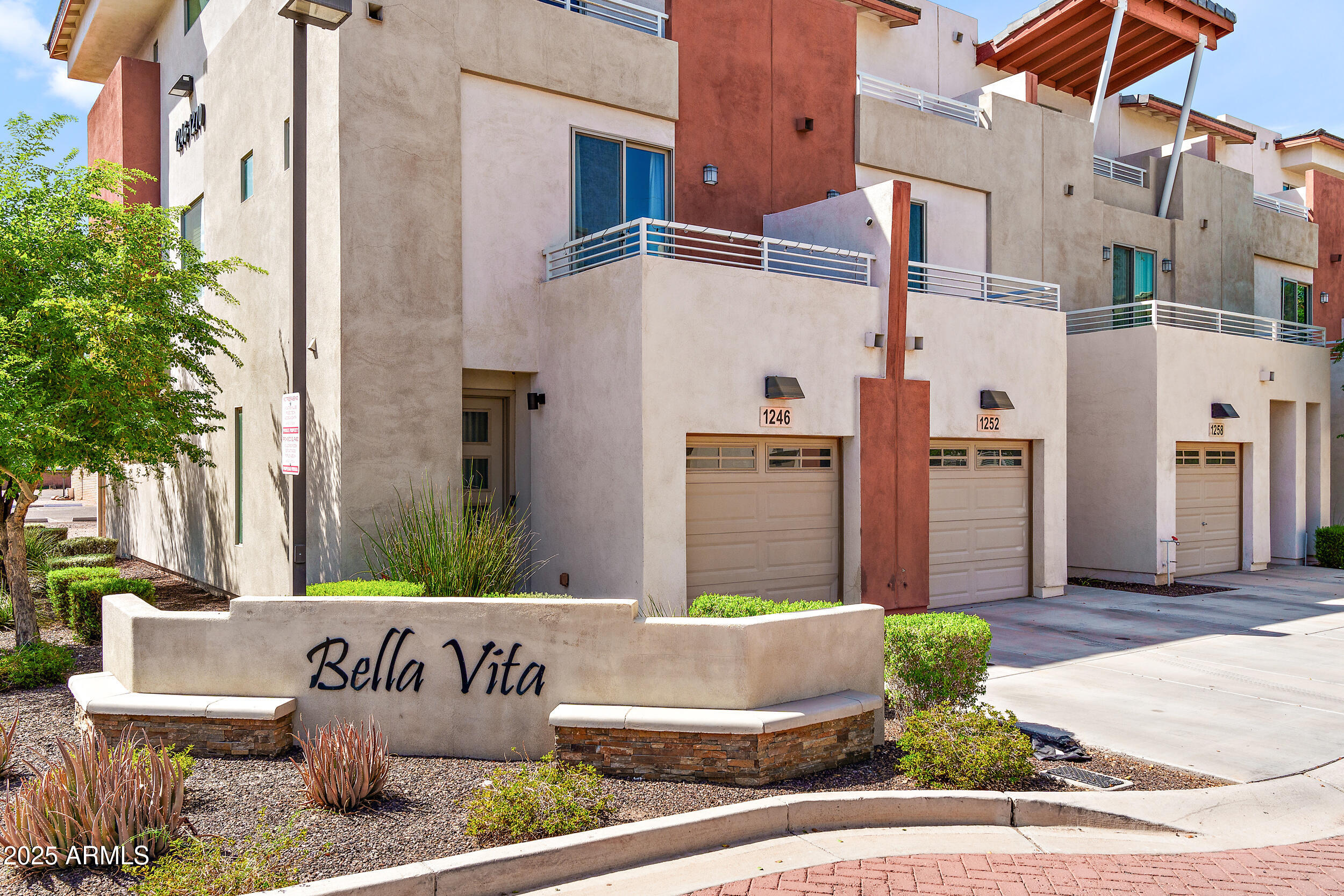 a front view of a building with garden