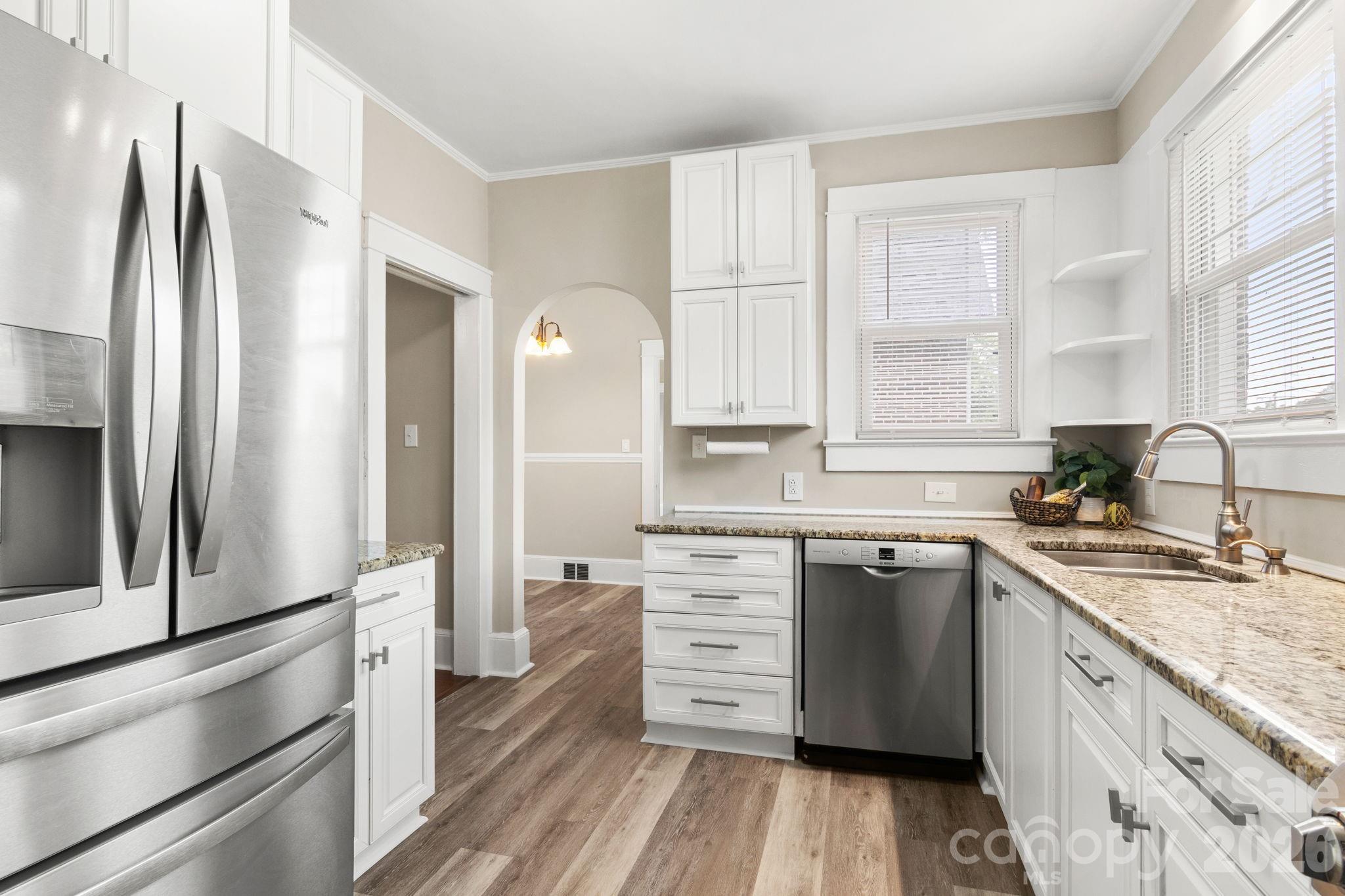 108 Reedy Street Chester, SC 29706 - Photo 14 of 42 a kitchen with stainless steel appliances granite countertop a refrigerator sink and cabinets