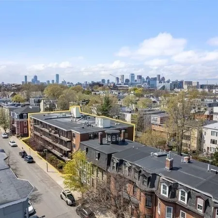 an aerial view of a house with a terrace