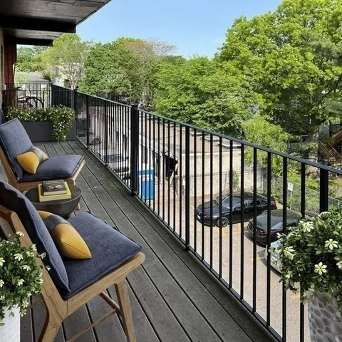 a view of balcony with furniture