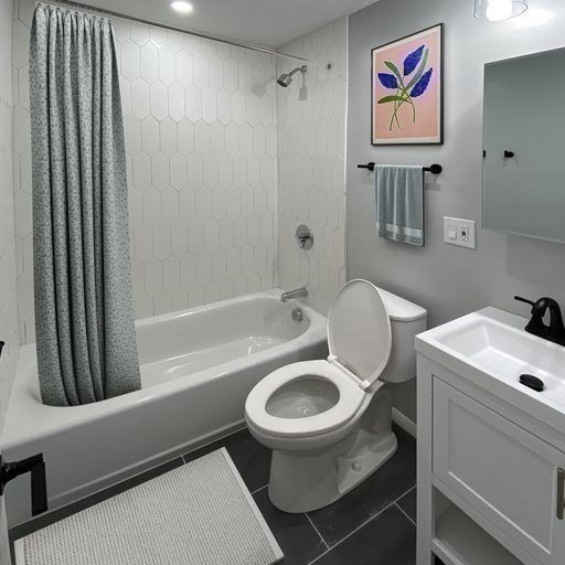 880 East 4th Street, Unit 410 Boston, MA 02127 - Photo 7 of 9 a bathroom with a sink a toilet and a bathtub