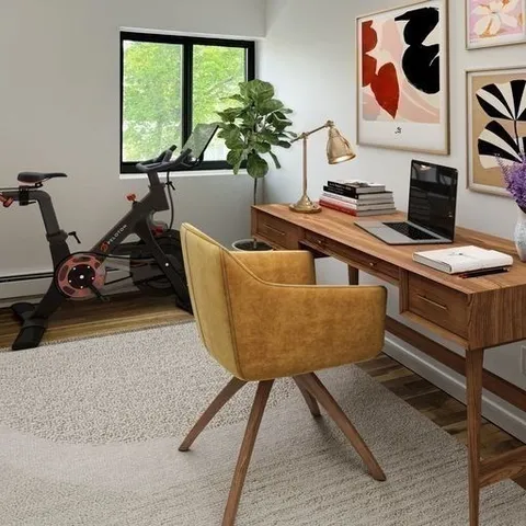 a living room with a couch and a window