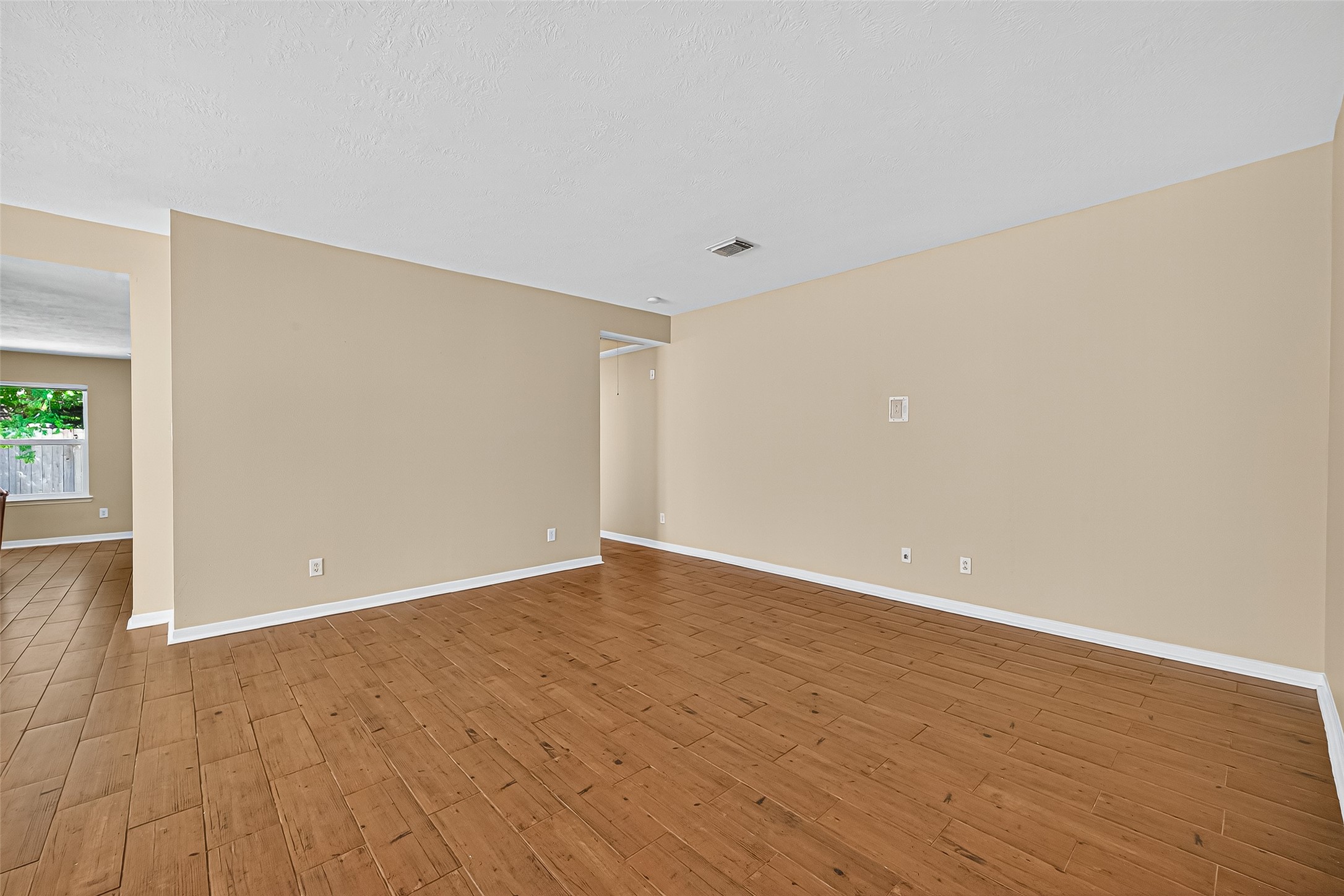 4630 Twisting Road Houston, TX 77084 - Photo 11 of 49 a view of an empty room with wooden floor